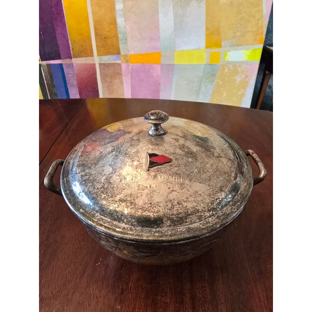 A fine and rare Yachting trophy silvered centerpiece with a most desirable enamel yacht enamel adornment on front top lid...