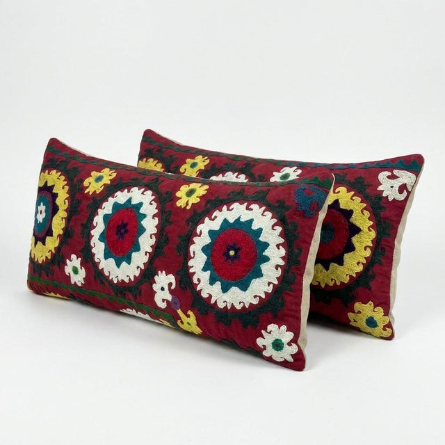 This beautiful 16'' x 33'' & 15'' x 33'' hand-embroidered Suzani pillow cover set was made from authentic Uzbek cotton...