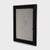 This antique Chinese mirror dates to the early 20th century and has a simple rectangular frame with beveled molding and...