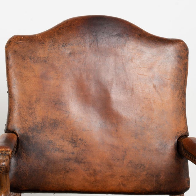 Pair of 20th century French armchairs, crafted in oak and upholstered in heavily distressed vintage leather. Wonderful...