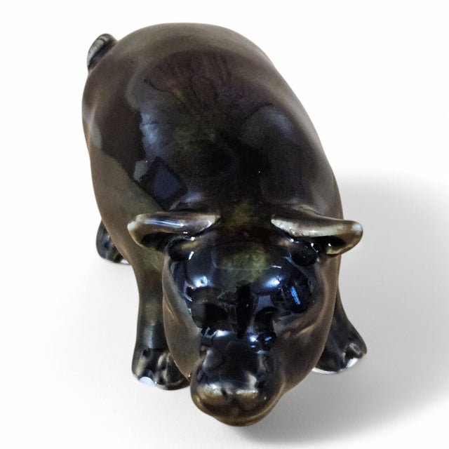 Description - A fine quality Chinese porcelain figurine in the form of a standing pig decorated in a rich brown glaze with...