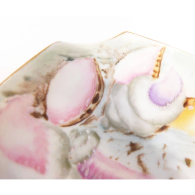 This is an oval tray marked Hutschenreuther & Co. it has hand painted details and is signed and dated Oct. 1926. It has...