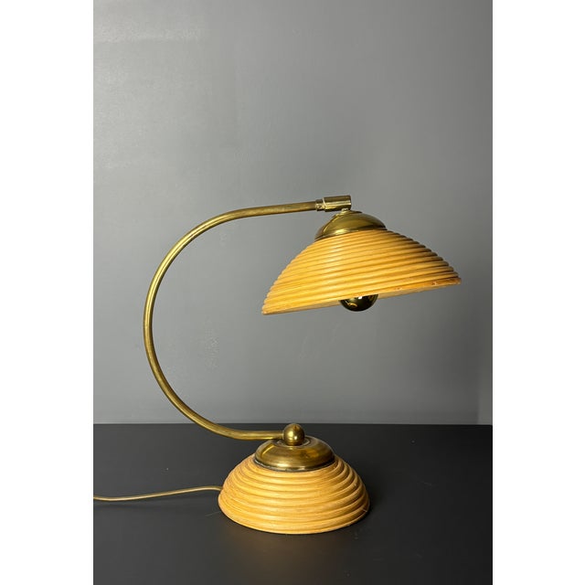 Gorgeous pencil reed rattan table lamp with brass. This lamp is in a lovely vintage condition with patinated brass. The...