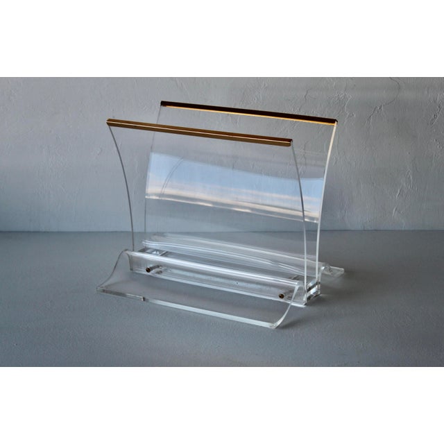 Vintage Thick Lucite Gold Trim Magazine Rack. In good vintage condition with minor wear and patina.