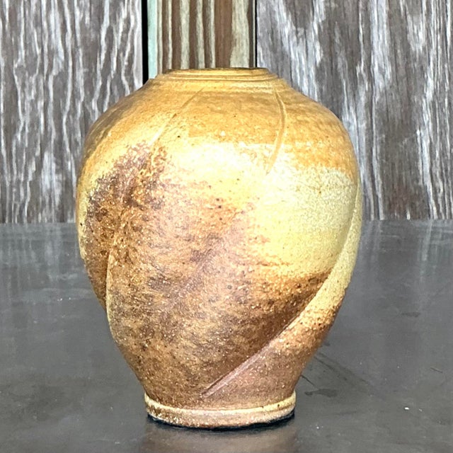 Bring artistic warmth to your space with this vintage Boho studio pottery vase. Handcrafted with earthy textures and a...