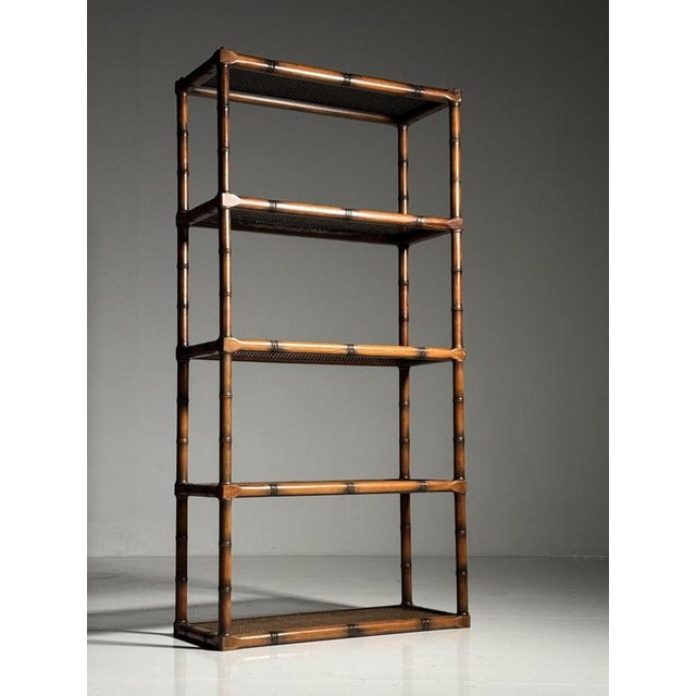 Faux Bamboo bookshelf / bookcase. Solid wood frame with a faux bamboo motif. The shelves are made of webbing and glass....