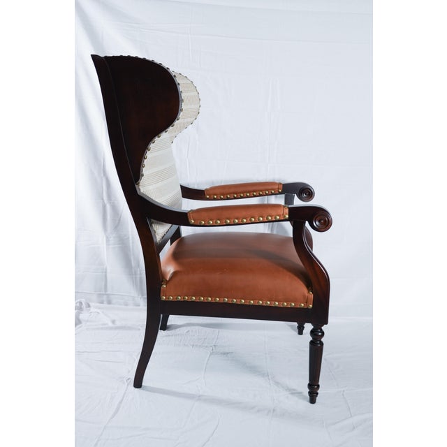 Biedermeier-style wing with exposed wooden hand-carved arms and legs. Upholstered cushions with Ralph Lauren's classic...