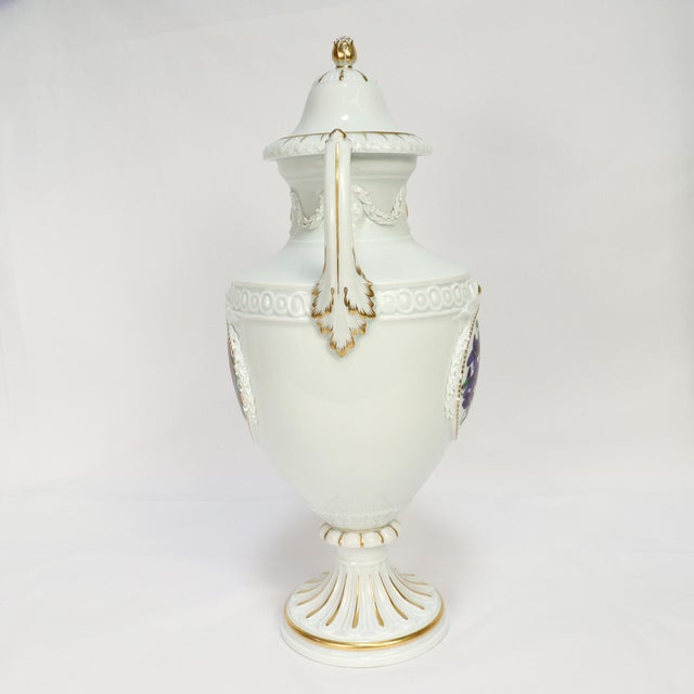 A fine signed German porcelain lidded urn or large vase. By Meissen. Decorated with applied and raised ribbons, laurels,...