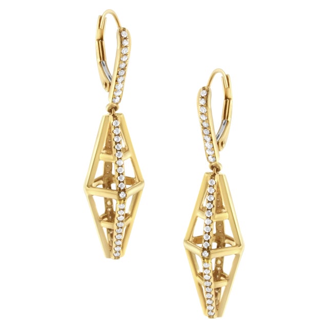 Dazzle and bewilder with a dash of architectural grandeur in these striking 14K yellow gold earrings, where sophistication...