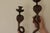 A remarkable pair of enameled brass wall sconces in the Egyptian Revival style featuring a striking single cobra design....