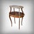 This Louis XV style tea table captivates with the grace of its curved uprights, adorned with gilt-bronze mounts where...