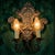 An elegant and evocative two-light wall sconce in the altarpiece style, a fine example of early 20th-century sacred and...