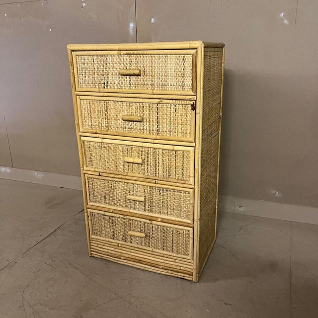 Vintage Cane and Bamboo chest of drawers The cupboard has 5 cane covered drawers Handles are bamboo Dimensions 95cm height...