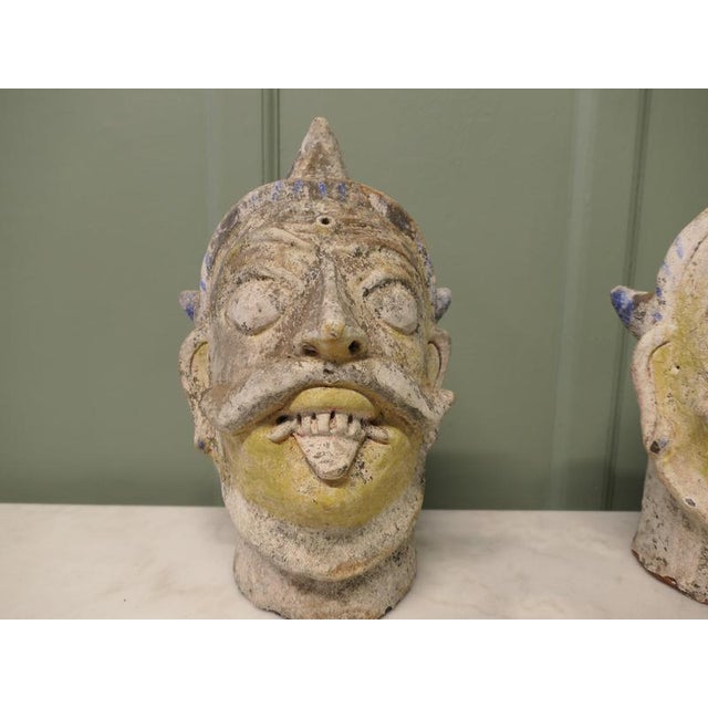 2 Large Antique Indian Terracotta Tent Pole Tops These wonderful pieces have been made in the image of frightening...