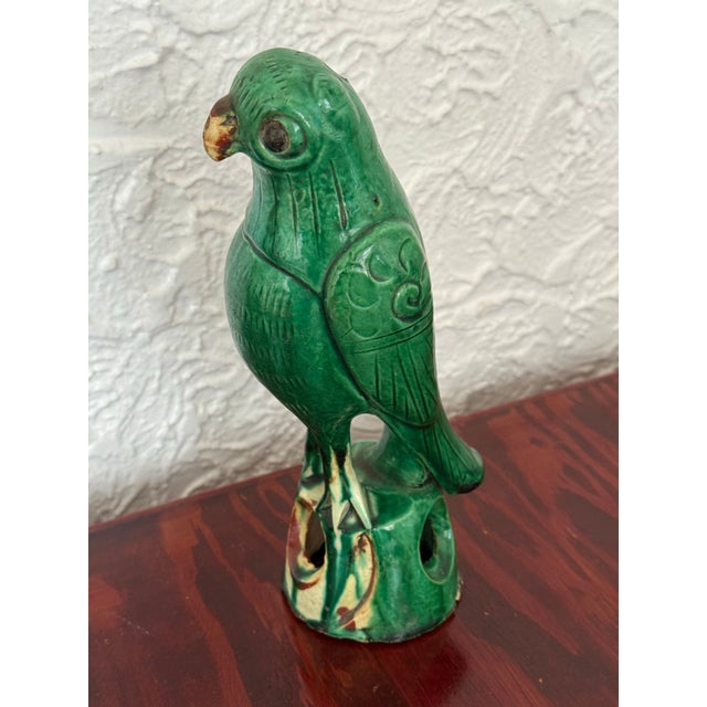 This antique Chinese pottery parrot was made as a roof tile figure, the kind of ornament once set along the ridges of...