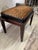 This is a stunning incredibly well made ottoman/piano bench. The base is a mahogany like finish with a box upholstered...