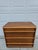 This classic three drawer walnut chest of drawers or dresser is designed by T.H. Robsjohn-Gibbings for Widdicomb out of...