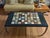 A stunning combination of 19th century elegance and modern design this coffee table features a Ne-classical specimen...