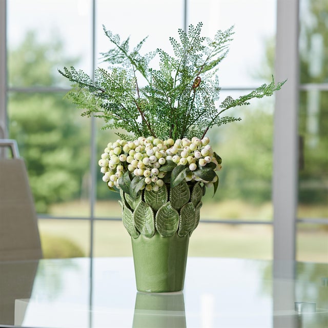 Bring nature indoors with the Stoneware Vase with Leaves Accent. Featuring earthy green tones and a glossy glazed finish,...