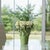 Bring nature indoors with the Stoneware Vase with Leaves Accent. Featuring earthy green tones and a glossy glazed finish,...