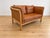 Made in Denmark by , this is a beautiful vintage Danish classic 2 person sofa upholstered in soft cognac leather, the sofa...
