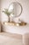 Italian console table from the 1950s with an elongated natural onyx top framed by a curved brass surround. The onyx...