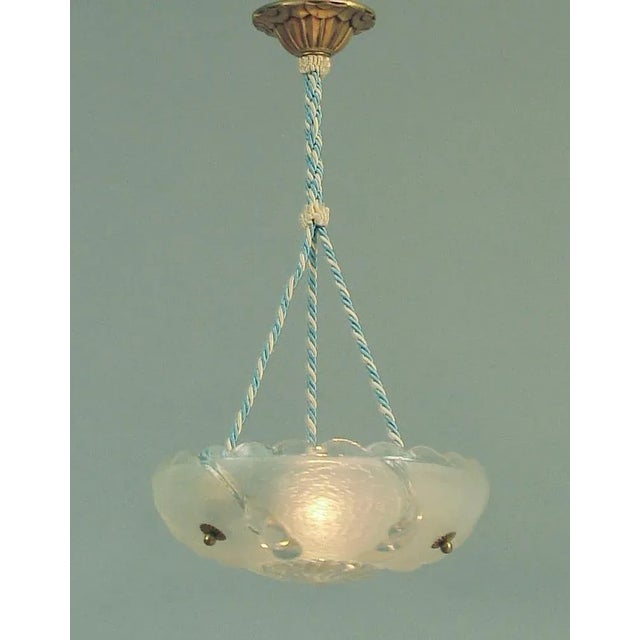 Offering a most attractive and useful hanging light, a combination of 40s American glass and a brand-new (gently used)...