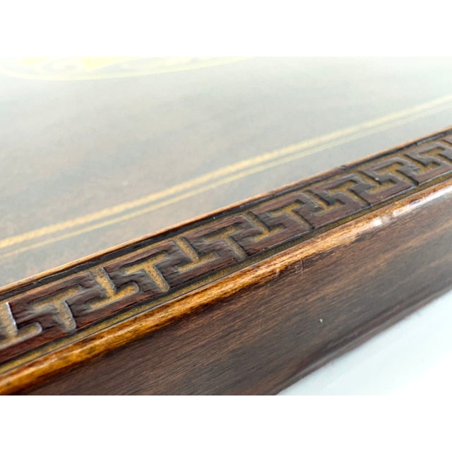 A stunning English Regency-style serving tray crafted in richly toned mahogany, featuring an elegant inlaid design with a...