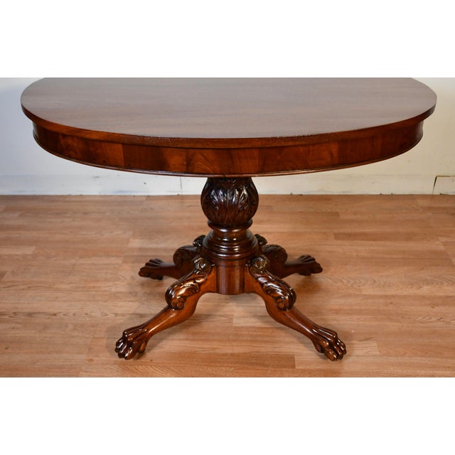 We are Pleased to offer this beautiful Antique American Empire table, from the 1880s . This table is made of solid...
