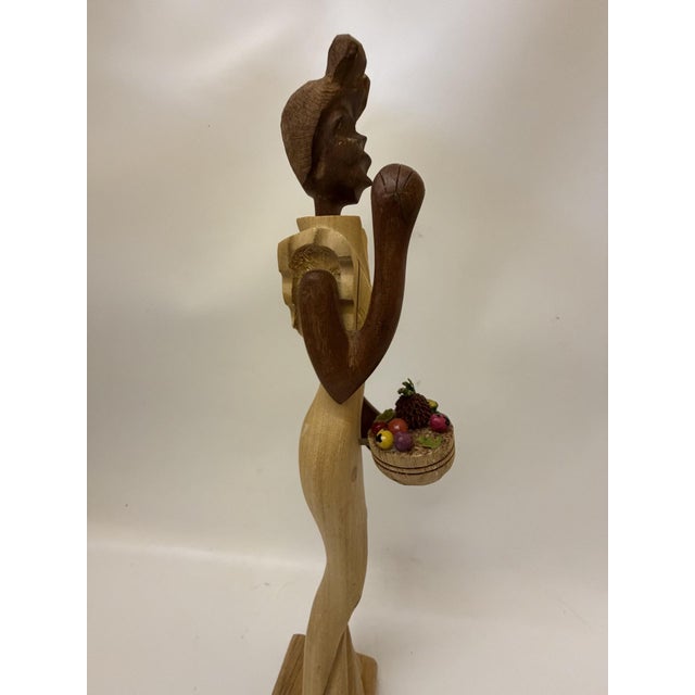 Bring soulful, mid-century warmth and vibrant character to your space with this stunning vintage Caribbean folk art...