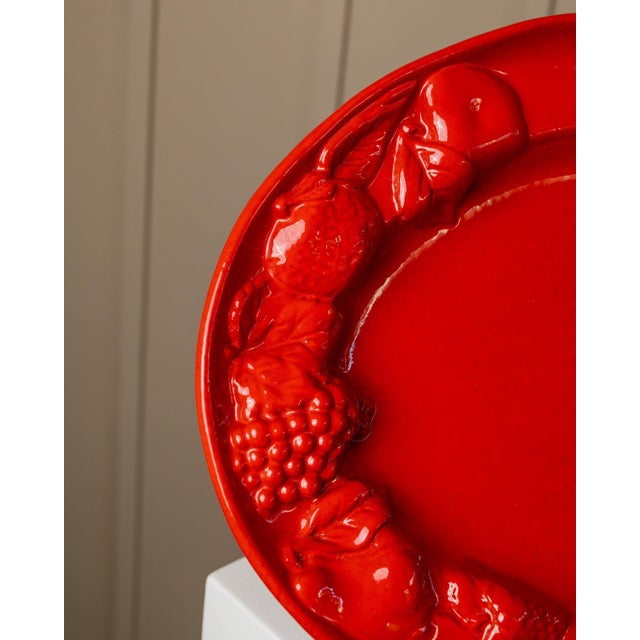 Nostalgic 1980s flair with our unique handmade vintage ceramic plate! This oval fruit plate features vibrant red, an...
