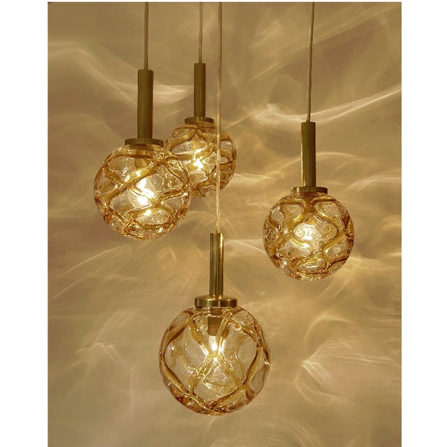 Mid-Century multi-layer by Doria, cascade style chandelier, pendant light with 4 individual lights with amber color molten...