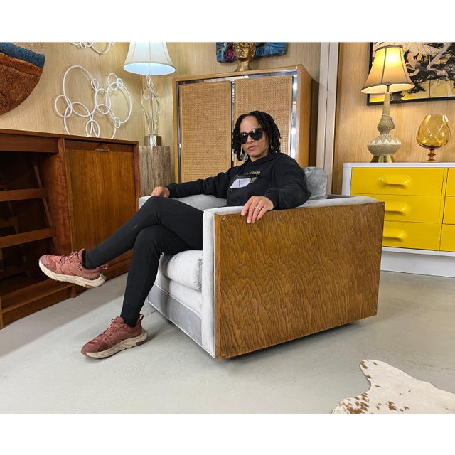 This 1970s cube shaped tuxedo club chair is stately, broad, heavy, masculine and sturdy. The deep seats and thick cushions...