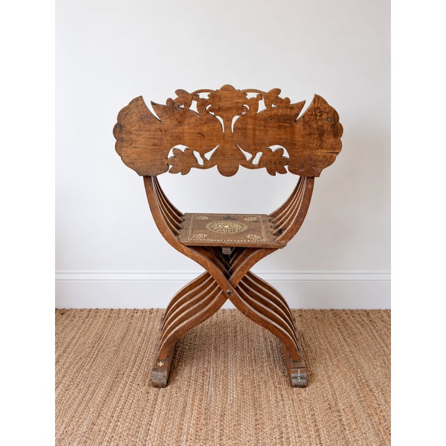 An extraordinary 19th-century Anglo-Indian Savonarola chair, with intricate bone inlay and an exquisitely carved back...