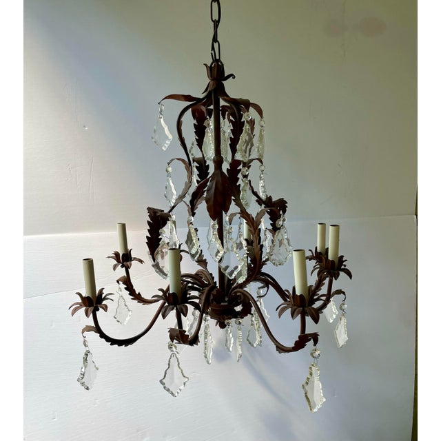 Large Scale Tole and crystal chandelier. Eight arms. Ready to hang with original ceiling cap. Measures: 26" diameter x 28"...