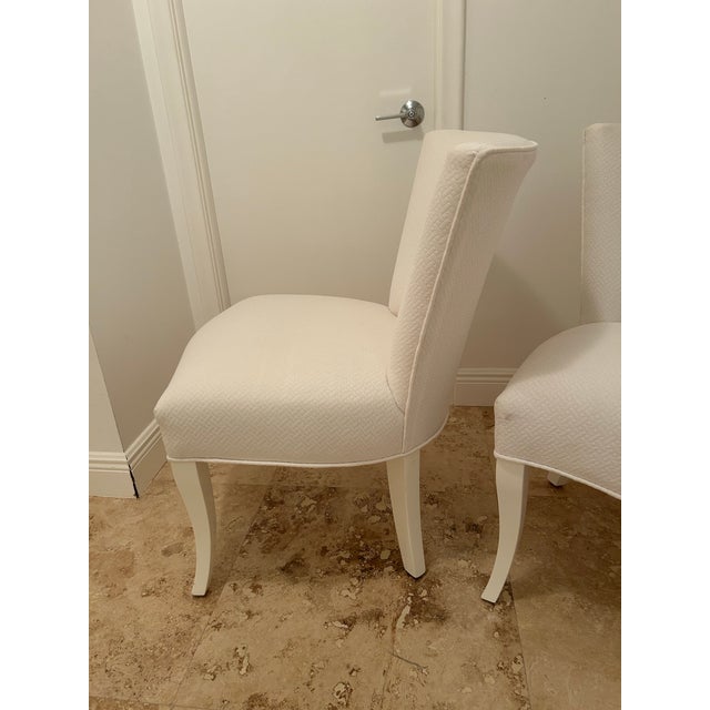 Gorgeous pair of soft and super comfortable slipper chairs or side chairs. They are lacquered in high gloss white and...