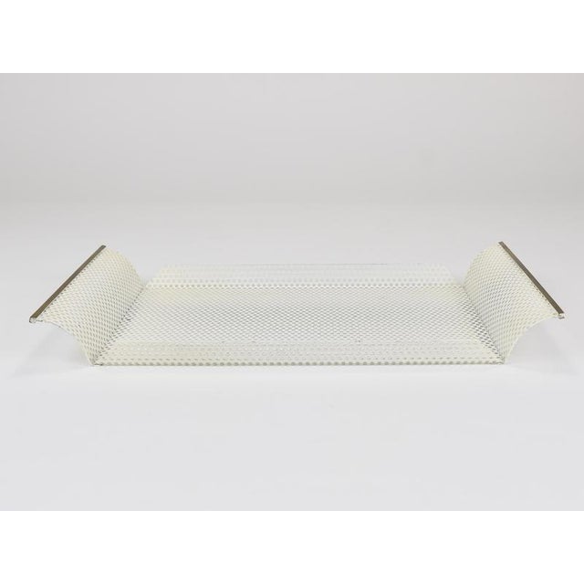 A minimalistic and elegant Mid-Century-Modern / Hollywood-Regency style rectangular tray from the 1970s, crafted by...