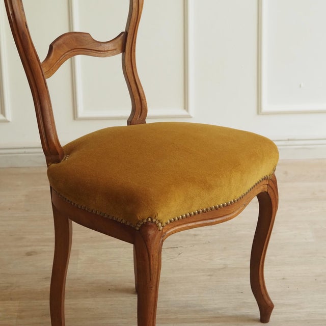 Upholstered side chair in the Louis-Philippe style, made around 1900 as a revival of mid-century French design. The curved...
