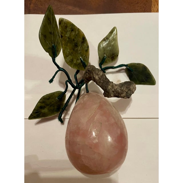 This is a wonderfully decorative rose quartz pear with green stone leaves that would add a fun touch to almost any decor...