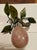 This is a wonderfully decorative rose quartz pear with green stone leaves that would add a fun touch to almost any decor...