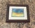 An evocative original abstract watercolor inspired by the meeting of sky, land, and light. Rich teal and deep blue blend...