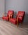 Pair of armchairs with curved wooden frame and red faux leather upholstery, Italian design, 1950s.