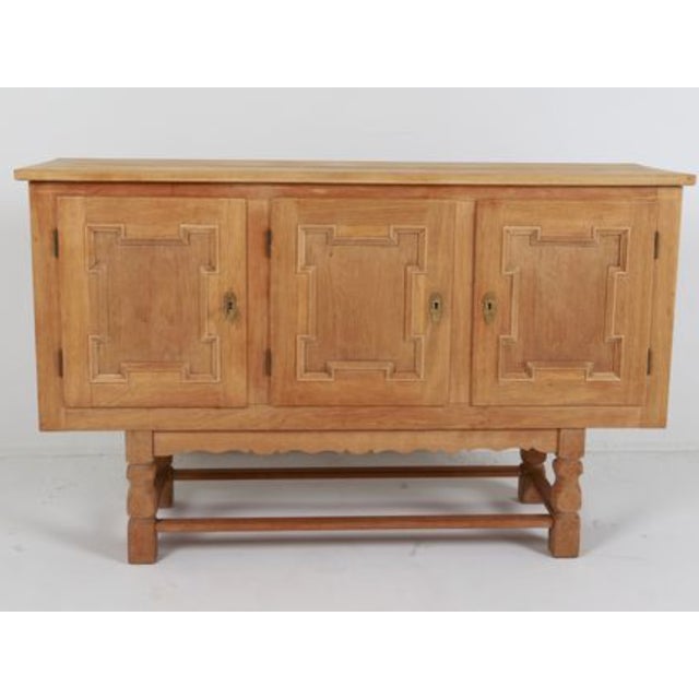 Key included. Adjustable shelves. Dimensions: H 34" x W 55" x D 16.5". Condition: Few water marks inside cabinets. Small...