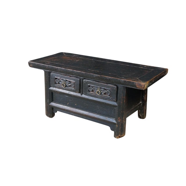 Antique primitive Chinese Chinoiserie black lacquered low Kang altar table / coffee table / console or bench featuring...