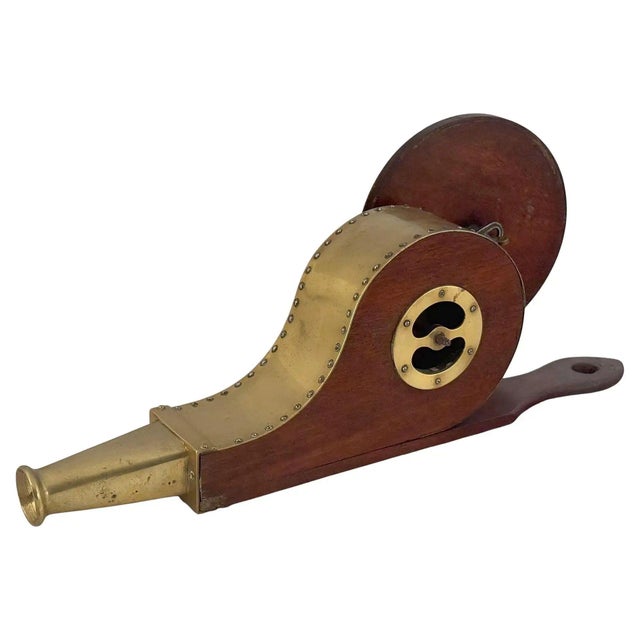 A fine English mechanical fire bellows of brass and mahogany from the Georgian era, used for blowing air on a fire - the...