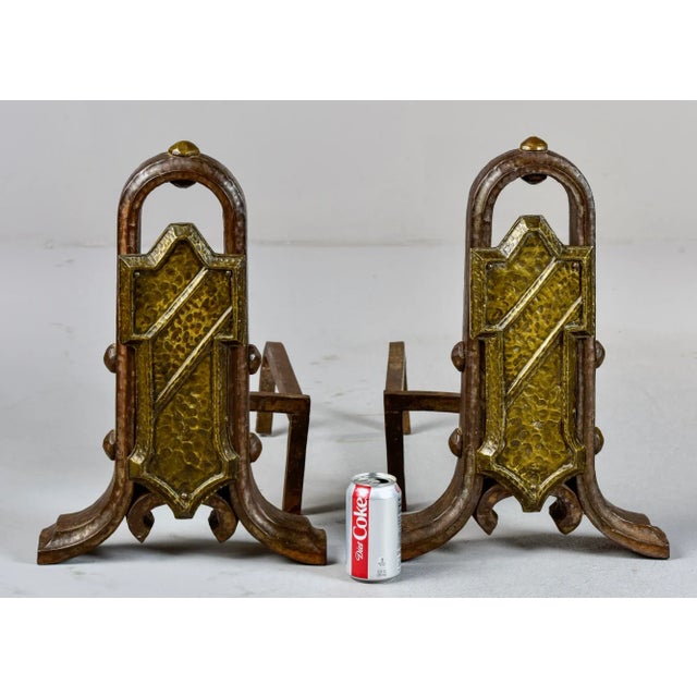 Circa 1910 pair of extra large andirons with plenty of Arts & Crafts era style in the hammered iron and brass fronts....
