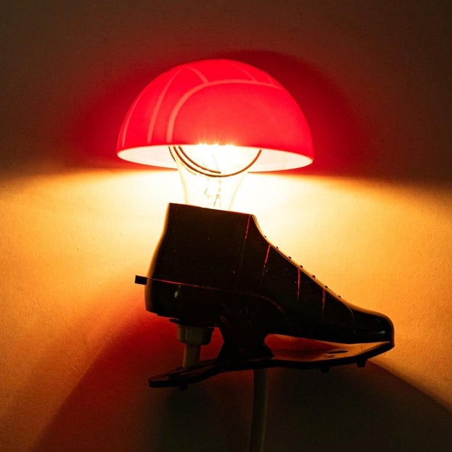 Bakelite lamp in the shape of a football. The top of the lamp is shaped like a football and fits directly onto an E14...