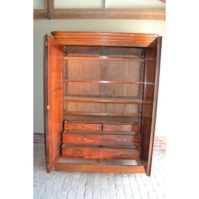 of a 19th-century Dutch mahogany gate cabinet. The height is 218 cm. The width is 167 cm. The depth is 60 cm. Fully...