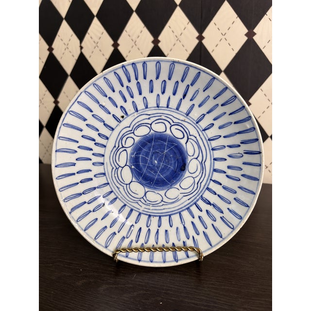 Pair of antique Chinese blue-and-white porcelain plates, attributed to the late Qing dynasty, featuring bold cobalt-blue...