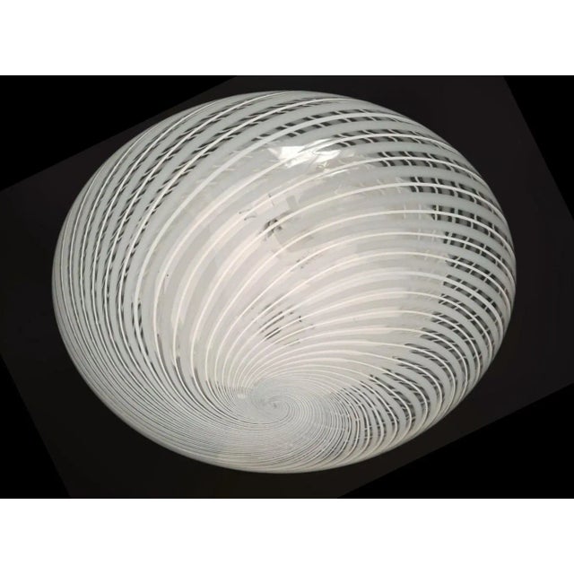 Elegant vintage Italian flush mount with a single clear Murano glass shade hand blown with thick and thin milky white...